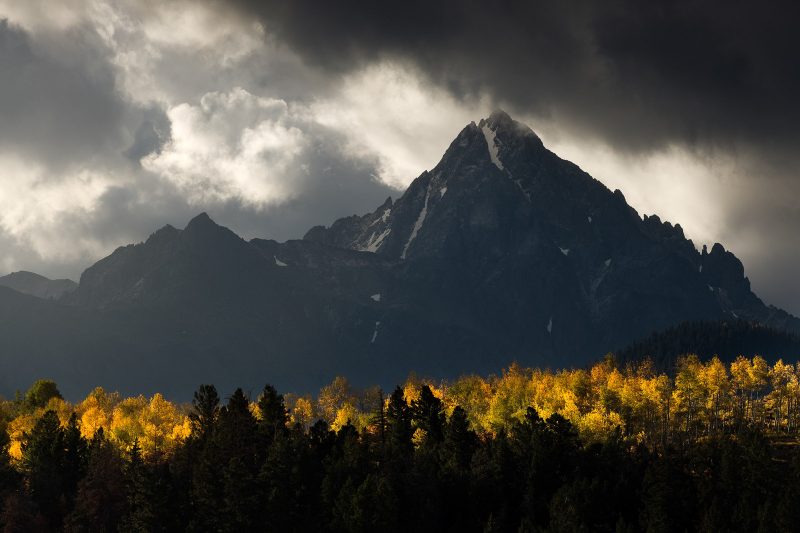 Colorado mountains above an autumn forest 